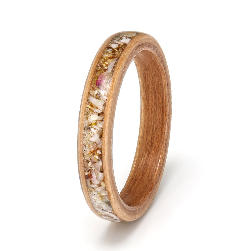 Apple bentwood ring with a cherry wood liner and a centred inlay of mixed shells and petals | by Eco Wood Rings