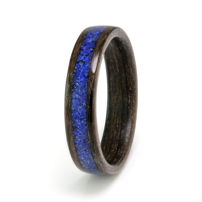 Alternative wedding ring | 4mm wide bogwood ring with a 2mm wide centred inlay of lapis lazuli | by Eco Wood Rings