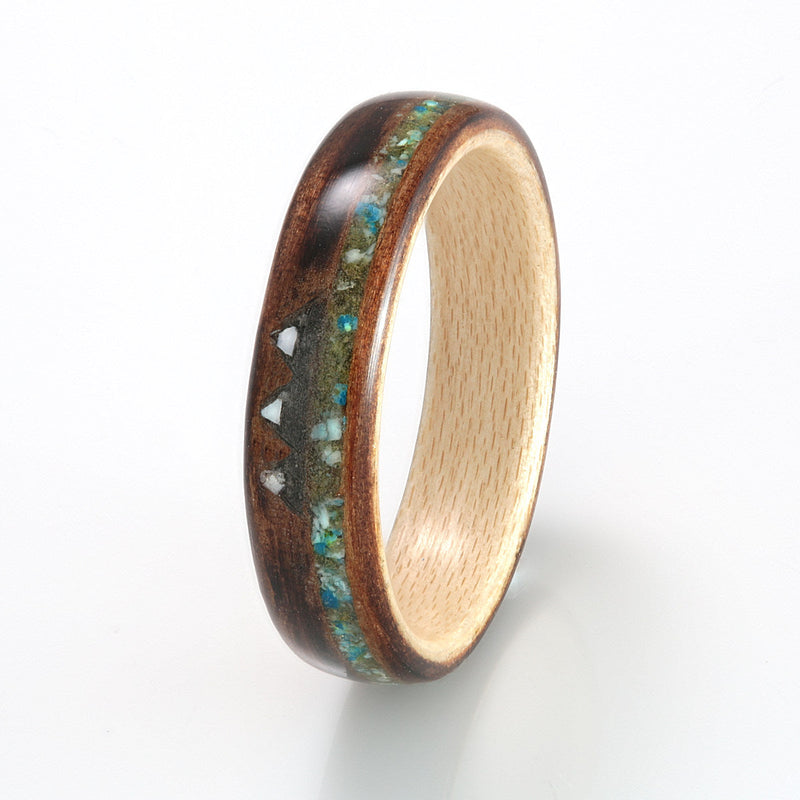 Custom mountain wedding ring | Charred cedar ring with maple liner and a mixed material mountain inlay | by Eco Wood Rings UK
