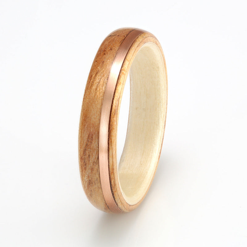 Welsh ash bentwood wedding ring with a willow liner and an off centre inlay of rose gold | 4mm wide | Ethical wedding ring