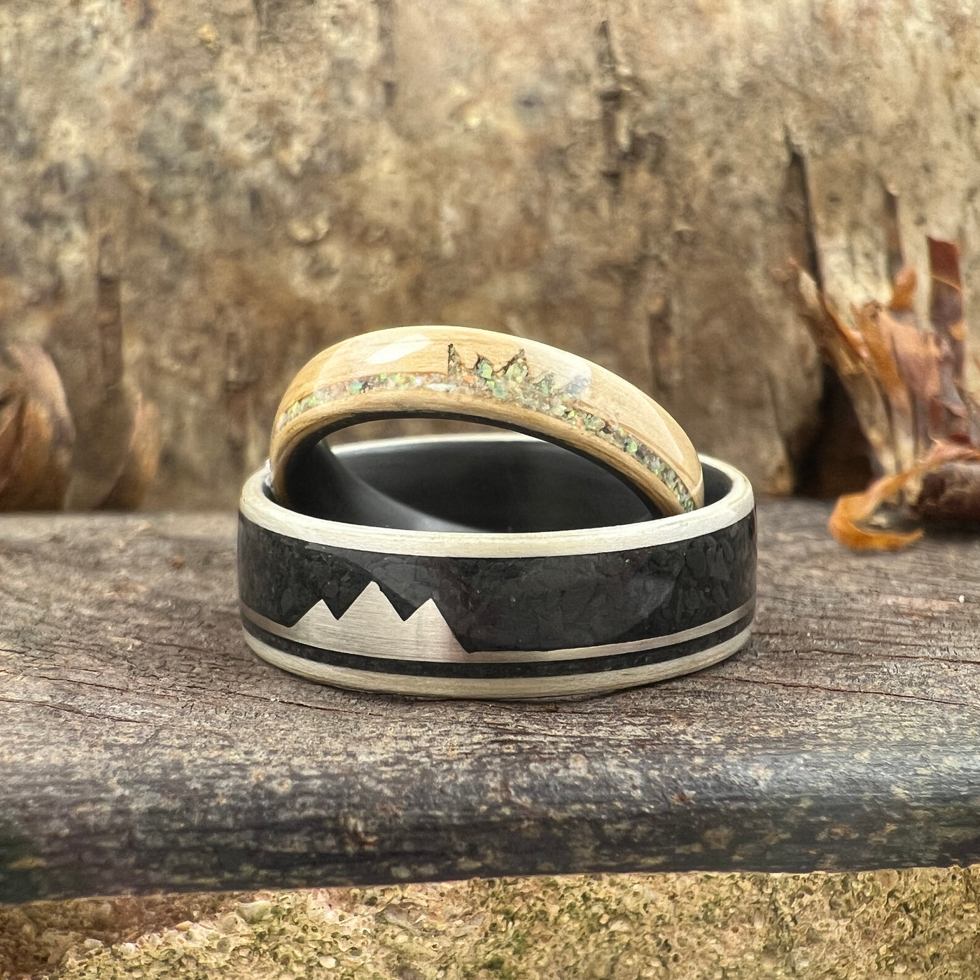 custom wooden and metal rings with mountain siloutte 