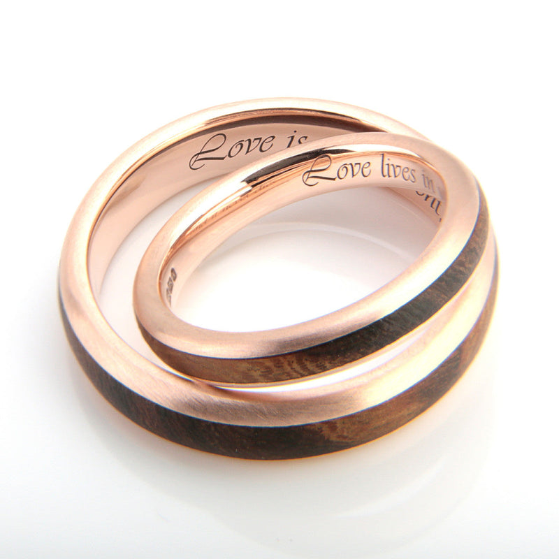 His and hers matching 9ct rose gold rounded edge wedding rings with inlays of rosewood - by Eco Wood Rings