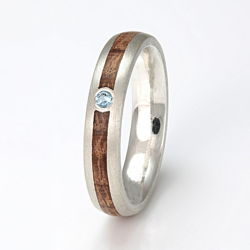 9ct white gold alternative engagement ring | 4mm wide with rounded edges and a centred inlay of oak meeting at a round topaz