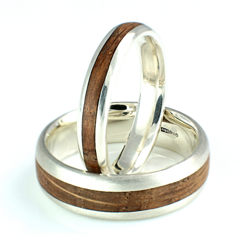 His and hers wedding band set | Rounded edge 9ct white gold rings with centred inlays of oak | 6mm and 4mm wide