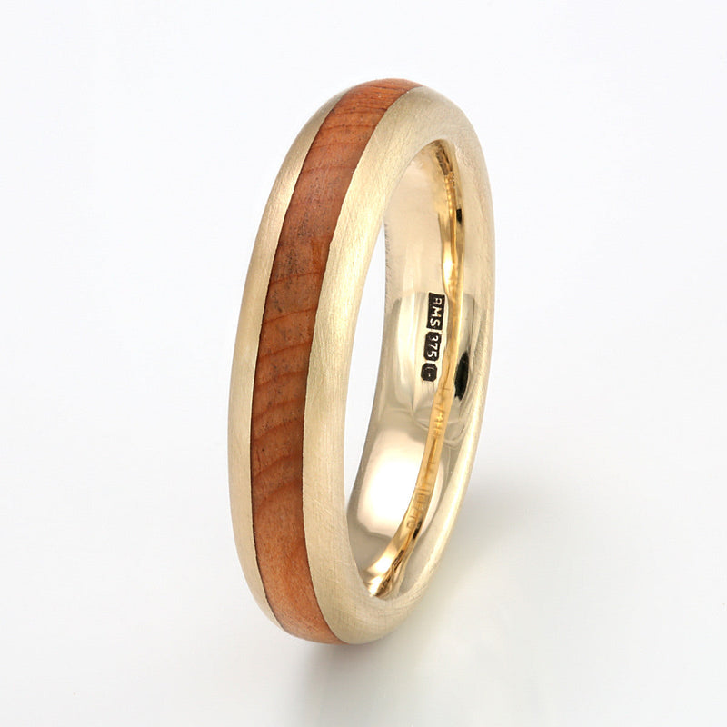 9ct yellow gold wedding ring for men and women | Rounded edge with a centred inlay of yew wood | 4mm wide with 2mm inlay