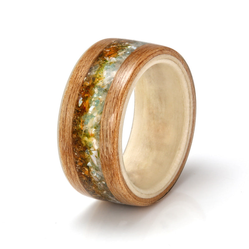 Alder bentwood ring with a rowan liner | Two inlays, one of aquamarine and mother of pearl, the other of tigers eye and moss