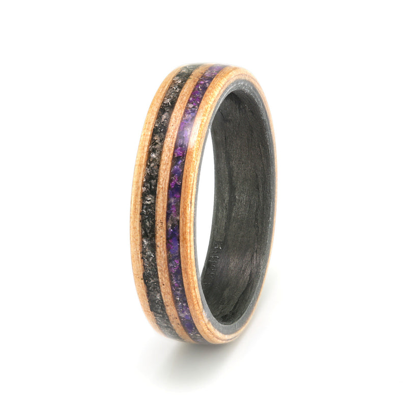 Apple wood wedding ring with a carbon fibre liner and two inlays, one of granite and the other of mixed amethyst and agate