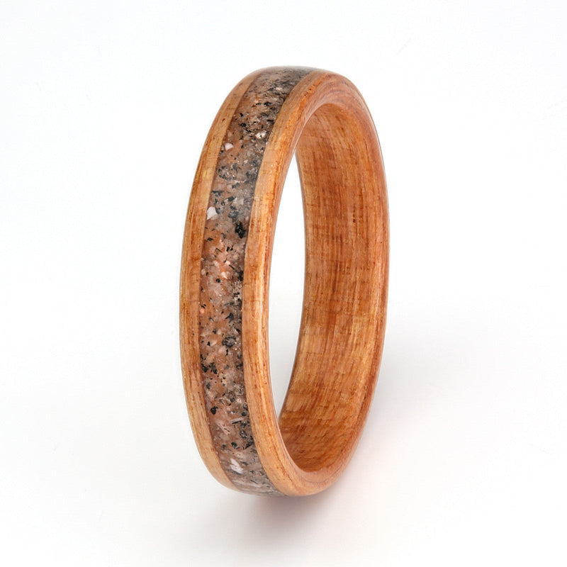 Custom engagement ring | Black cherry wood ring with a centred inlay of mixed shells and stones | by Eco Wood Rings
