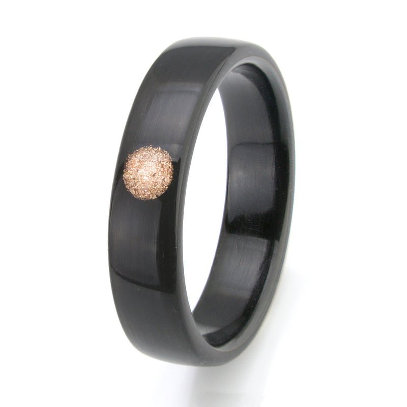 Non traditional engagement ring | Dark bogwood bentwood ring with a circular inlay of gold shavings | by Eco Wood Rings