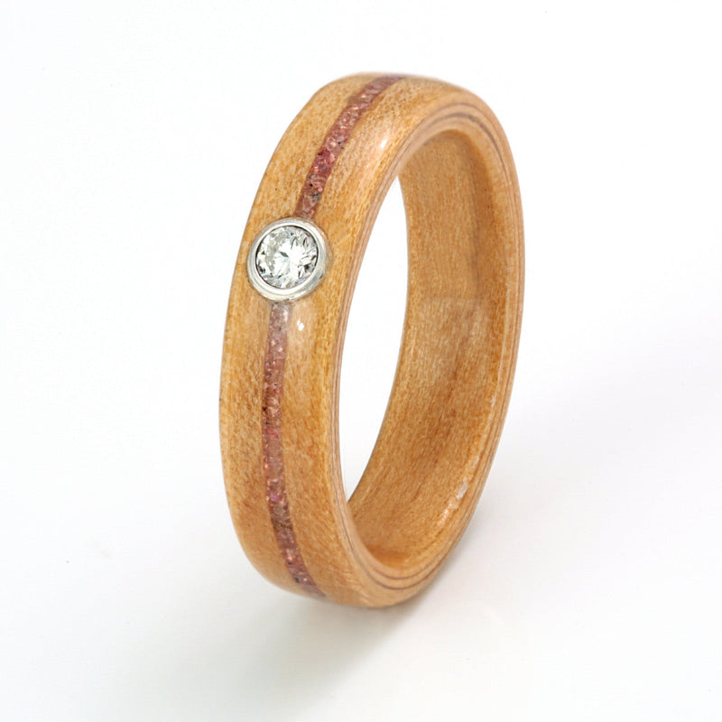 Ethical engagement ring | Cedar wood ring with a centred inlay of amethyst and ruby meeting at a round moissanite in bezel