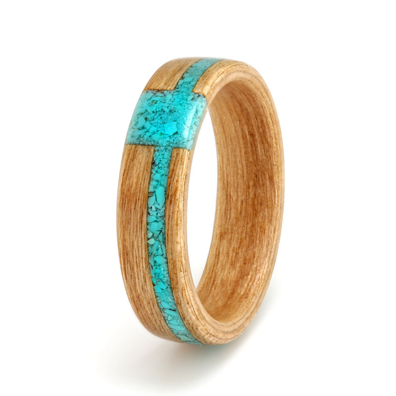 Birthstone engagement ring | Cherry wood ring with an off centre inlay of turquoise meeting at a square inlay of turquoise