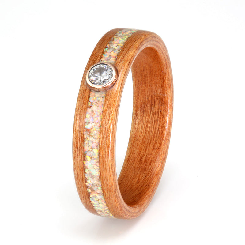 Affordable engagement ring hand made from cherry wood | Inlay of mixed opal, sunstone and moonstone meeting at a moissanite