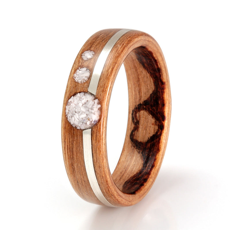 Affordable engagement ring | Cherry wood ring with off centre inlay of silver and three circular inlays of white shell
