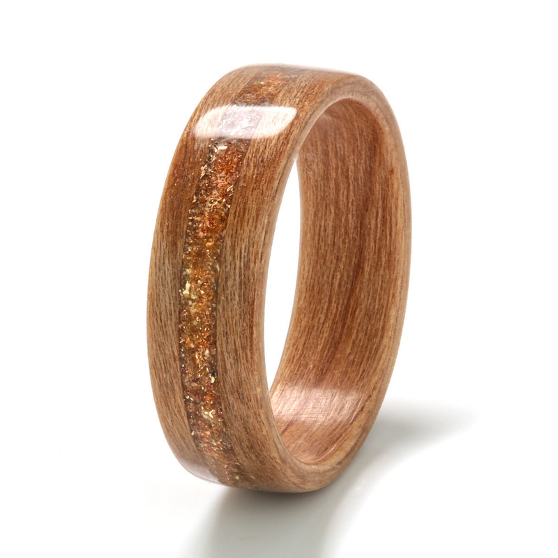 Vegan wedding ring | Cherry wood ring with a centred inlay of gold shavings, ochre, goldstone and amber | by Eco Wood Rings