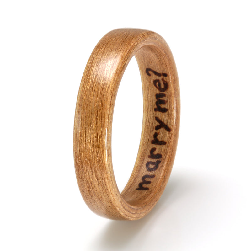 Simple engagement ring | 4mm wide cherry wood ring with the words marry me burned inside | by Eco Wood Rings UK