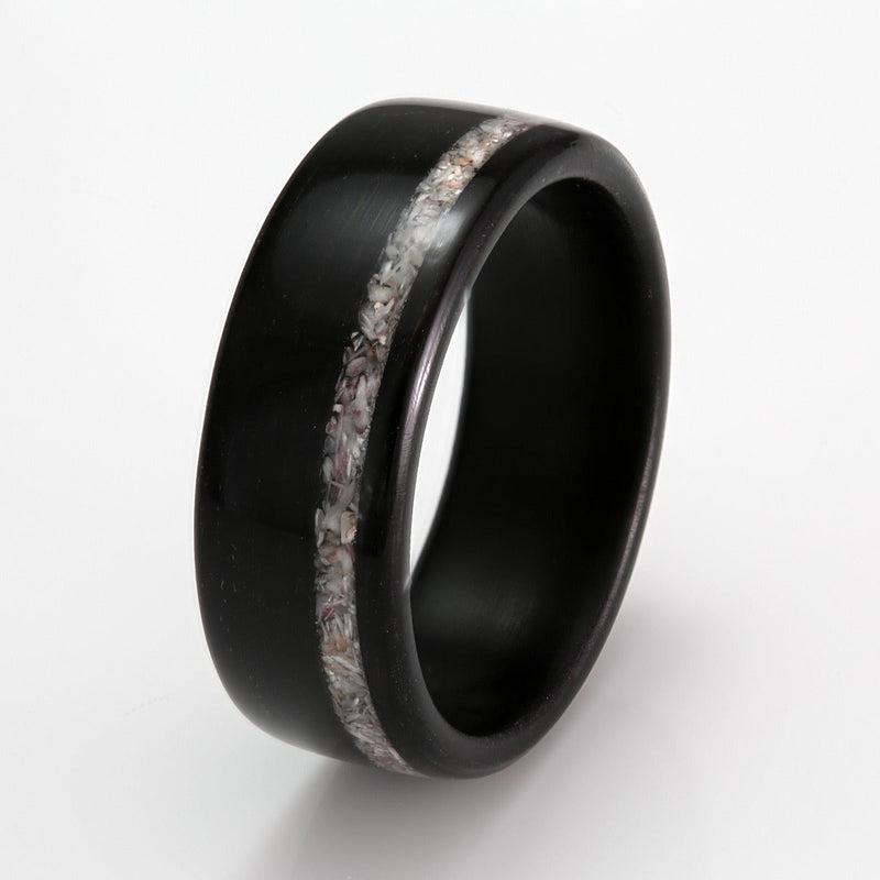 Wide ring design for men and women | Ebony bentwood ring with an off centre inlay of crushed shell | by Eco Wood Rings UK