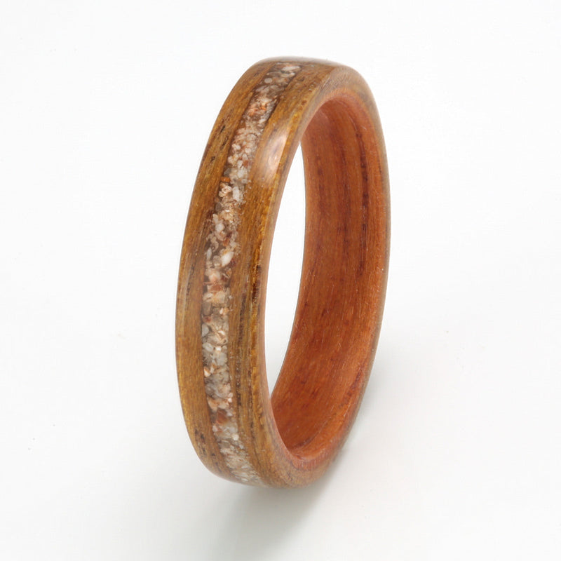 Custom wooden ring design | 4mm wide greenheart wood ring with an opepi teak liner and a 1mm centred inlay of sand and shell