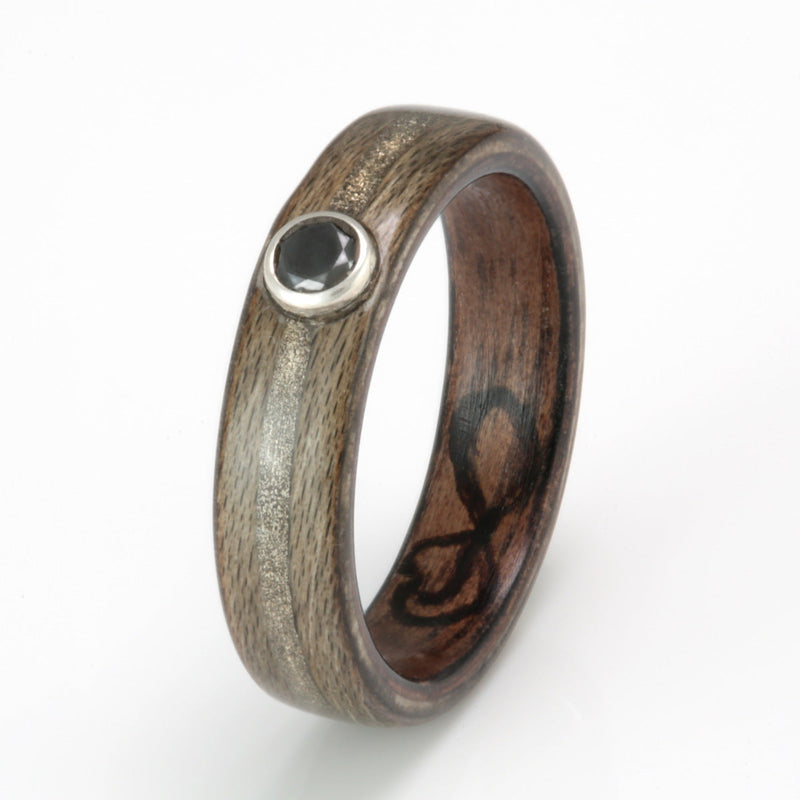 Ethical engagement ring | Greyed maple ring with a walnut liner and a centred inlay of white gold meeting at a black diamond
