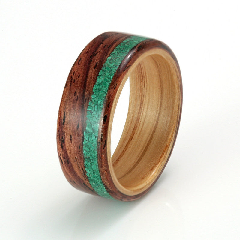 Unique wedding ring | 7mm wide Honduras rosewood ring with an oak liner an off centre inlay of malachite | by Eco Wood Rings