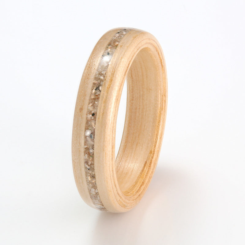 Simple wooden rings | 4mm wide chestnut bentwood ring with a 1mm wide centred inlay of sand & shells | by Eco Wood Rings